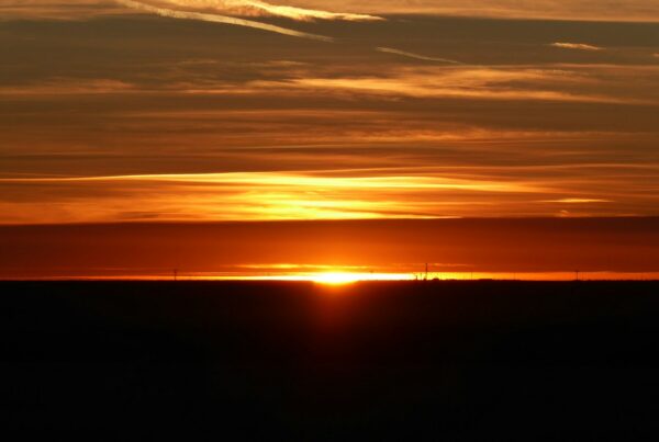 The sun is setting over the horizon of the horizon