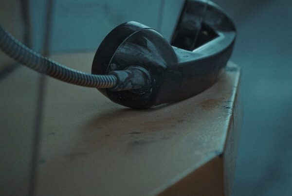 black and gray corded headphones