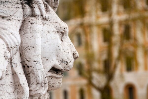 a close up of a statue of two lions